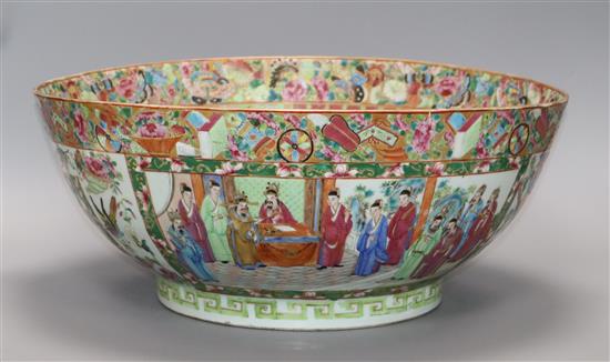 A large Chinese Canton-decorated famille rose punch bowl, c.1830, W.41.5cm, section broken and restuck, and two hairline cracks